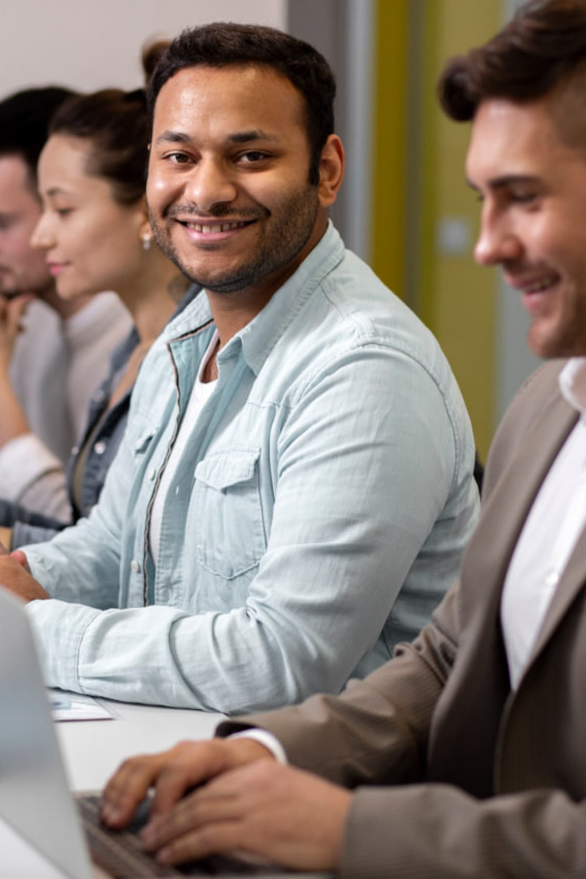 Professional IT consultants collaborating in high-tech corporate office